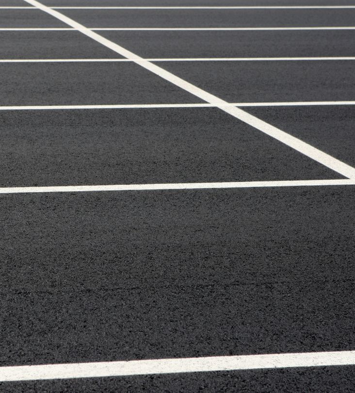asphalt parking lot close up with white lining naples fl